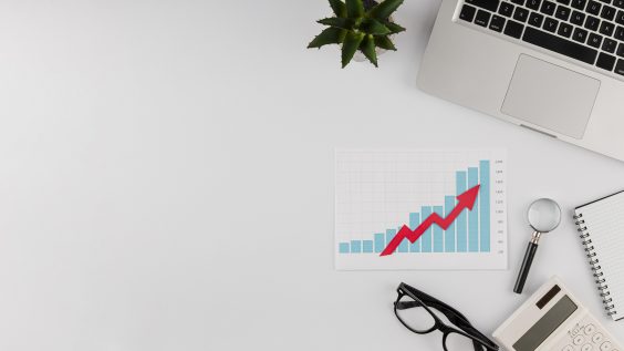 top-view-office-desk-with-growth-chart-copy-space